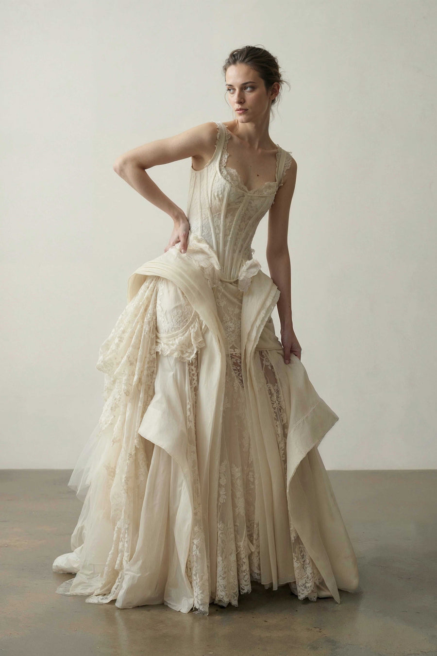 Antique-ivory couture gown in organza, lace and tulle with a boned corset bodice and draped panels by Bilal Barrage