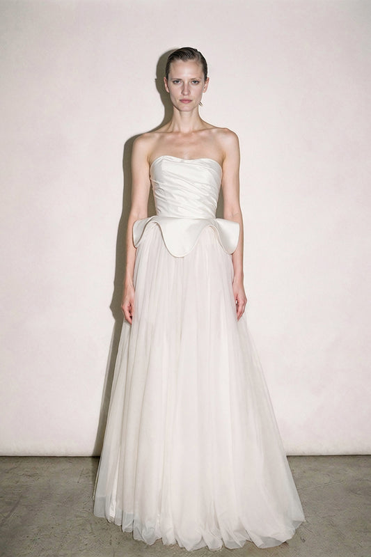 Ivory tulle couture gown with a draped asymmetric bodice and sculptural hip bow by Bilal Barrage