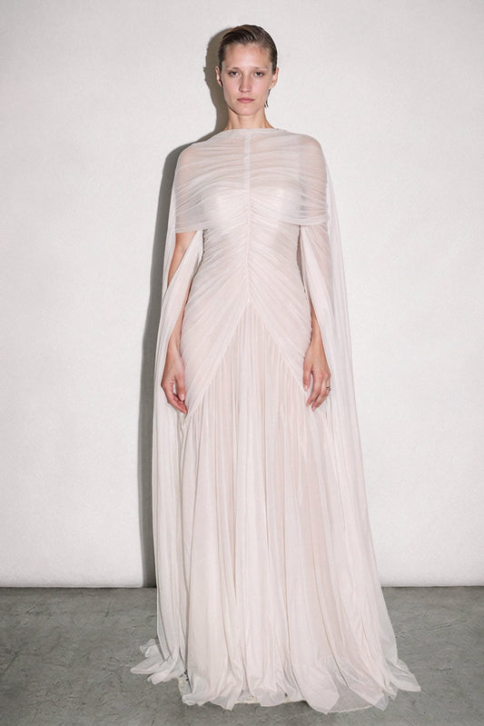 Powder-ivory tulle couture gown with a pleated chiffon capelet and fluid column skirt by Bilal Barrage
