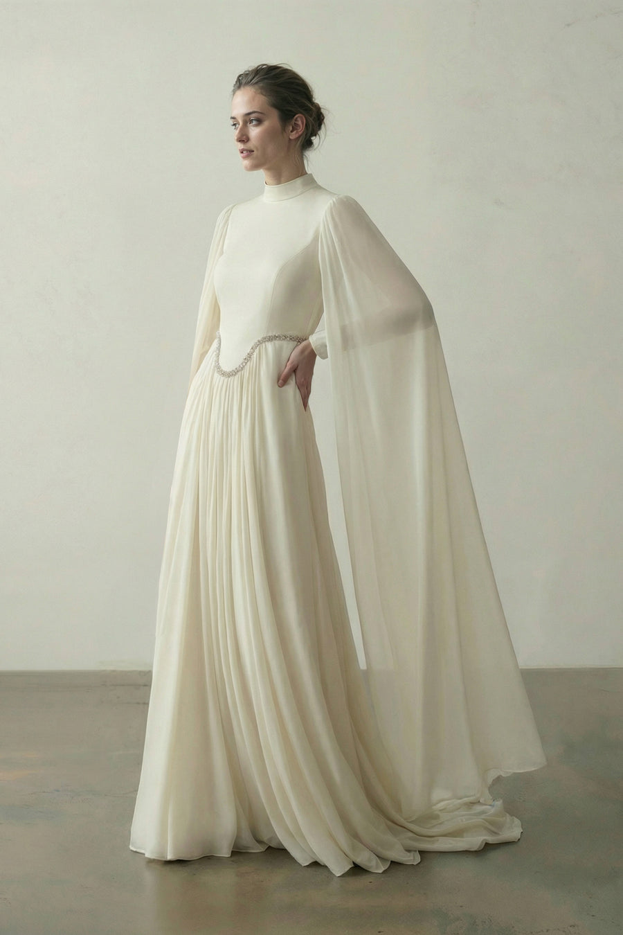 Ivory couture gown in lace and tulle with a boned corset bodice and sculpted draped panels by Bilal Barrage