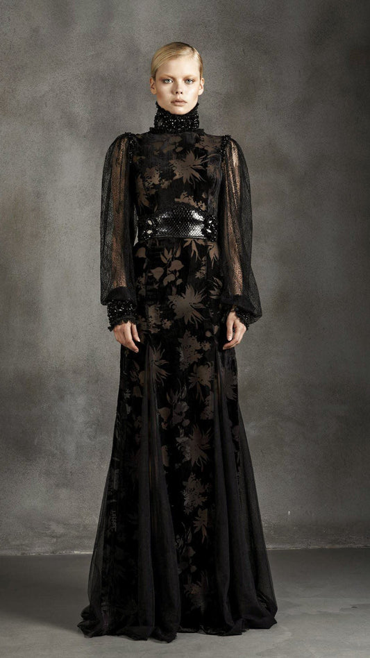Laser-cut floral velvet gown over sheer tulle with a lace high neckline by Bilal Barrage