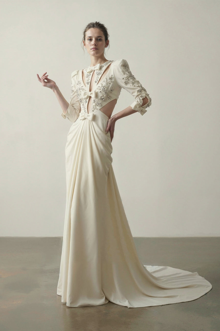 Ivory couture gown in lace and organza with a boned corset bodice and flowing draped panels by Bilal Barrage